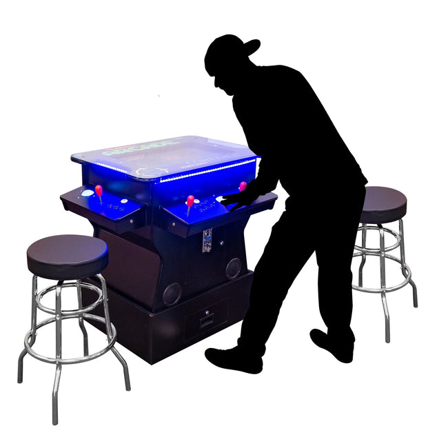 Silhouette Of A Person Playing A Cocktail Arcade Machine