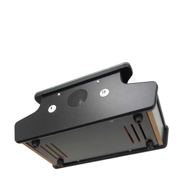 Underside View Of A Compact Black Arcade Unit With Rubber Feet