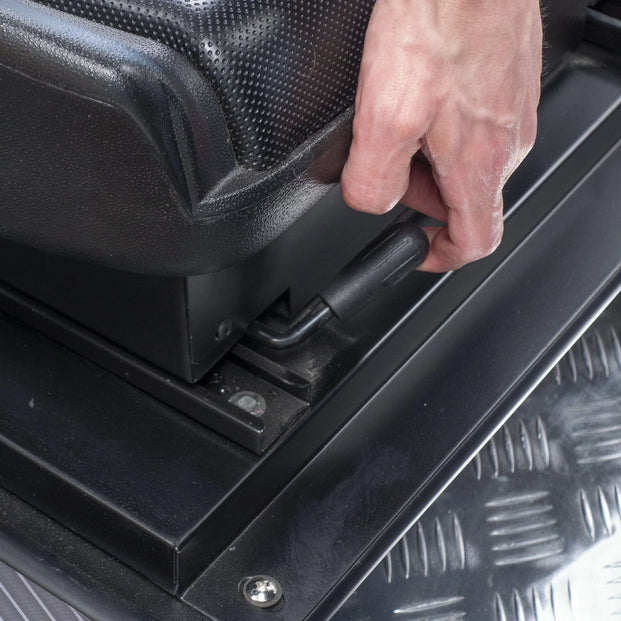 Hand Adjusting A Racing Simulator Seat
